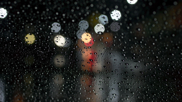 Rainy window blurry streetlight traffic free wallpaper for desktop - medium preview image