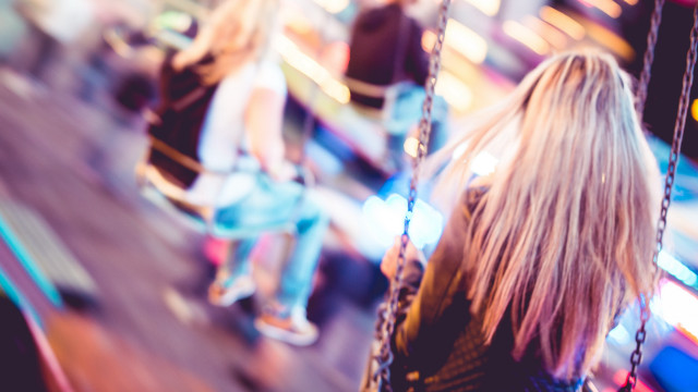 Carnival night swing blurry bokeh free wallpaper for desktop - medium preview image