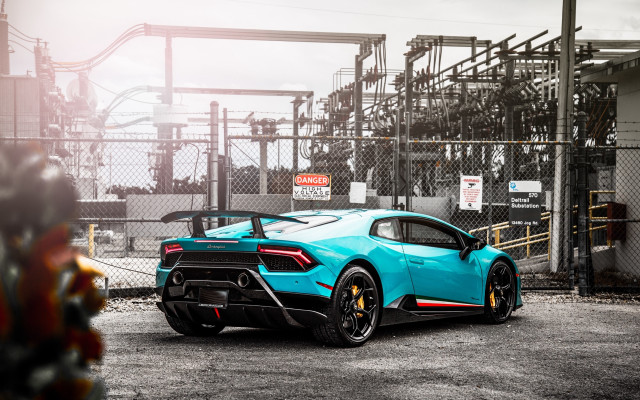Blue sports car factory chainlink free wallpaper for desktop - medium preview image