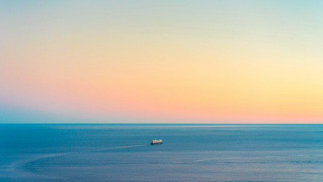 Ocean sunset beach boat minimalism free wallpaper for desktop - medium preview image