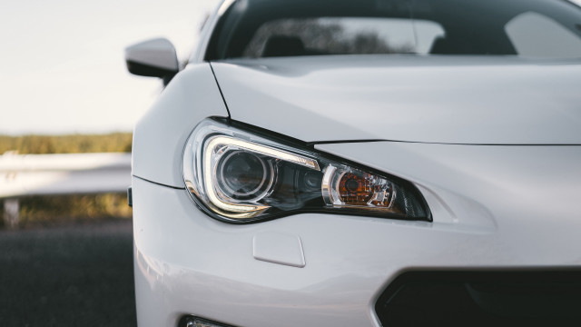 White sports car headlight road free wallpaper for desktop - medium preview image