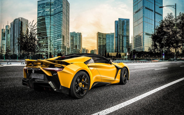 Yellow sports car cityscape night free wallpaper for desktop - medium preview image
