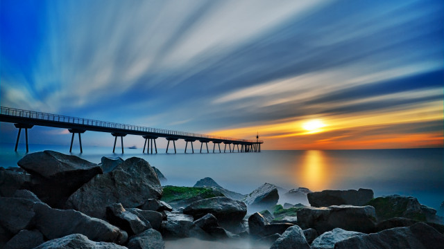 Long pier rocky beach sunset free wallpaper for desktop - medium preview image