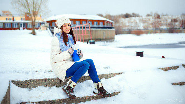 Woman sitting snow coat beanie free wallpaper for desktop - medium preview image