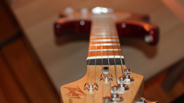 Guitar neck closeup bokeh shallow free wallpaper for desktop - medium preview image