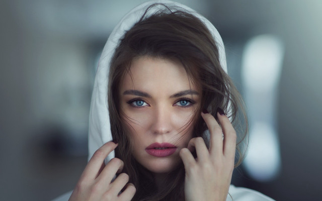 Woman hooded jacket serious portrait free wallpaper for desktop - medium preview image