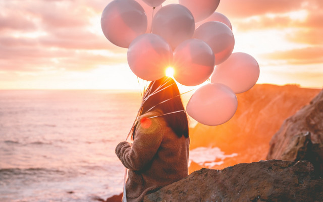 Balloons sunset ocean cliff cinematic free wallpaper for desktop - medium preview image