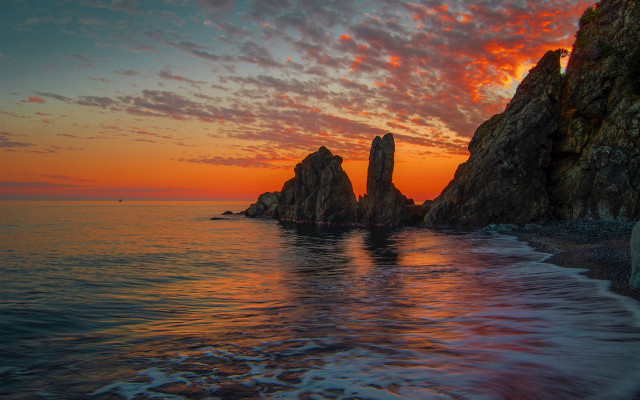 Sunset ocean rocks boat mystical free wallpaper for desktop - medium preview image