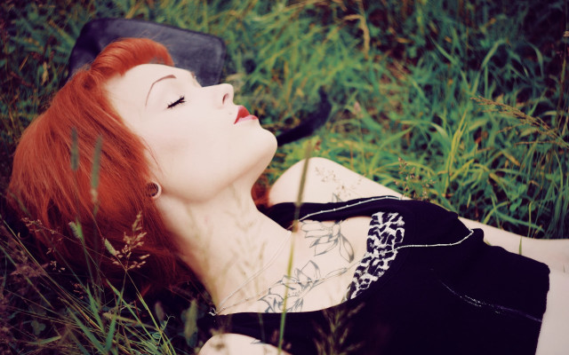 Gothic redhair laying in grass free wallpaper for desktop - medium preview image