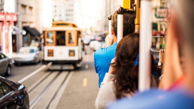 Woman streetcorner trolley car bokeh free wallpaper for desktop - medium preview image