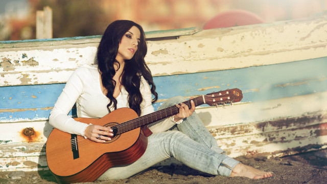 Woman sitting guitar beach sunset free wallpaper for desktop - medium preview image