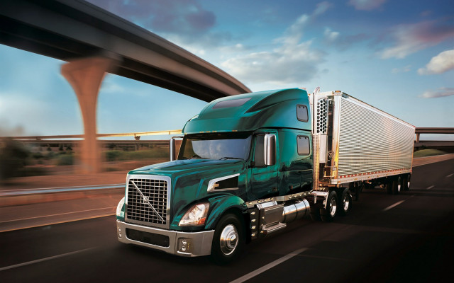 Green semi truck highway bridge free wallpaper for desktop - medium preview image