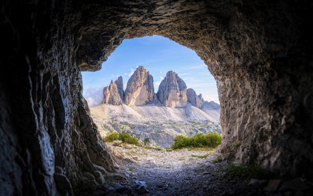 Mountain range through cave dirt free wallpaper for desktop - medium preview image