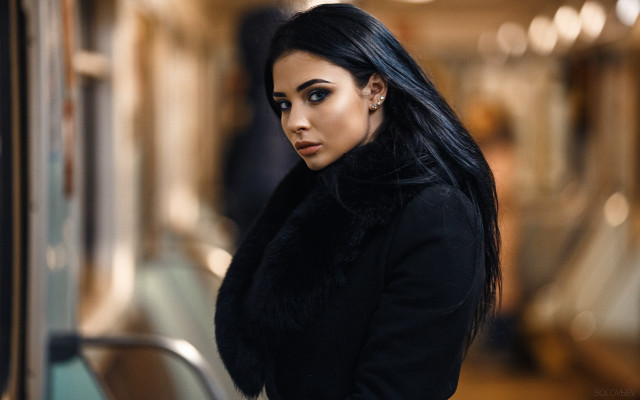 Woman blackhair subway serious portrait free wallpaper for desktop - medium preview image
