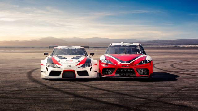 Two cars race track mountains free wallpaper for desktop - medium preview image