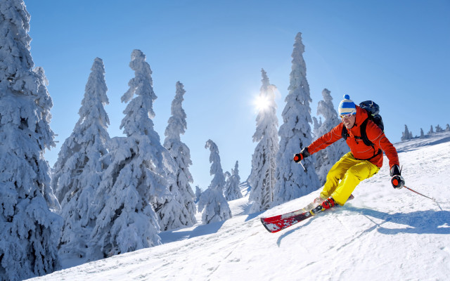 Skiing man snowy mountain sky free wallpaper for desktop - medium preview image