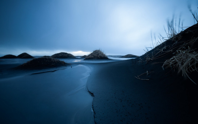Dark cloudy beach rocks grass free wallpaper for desktop - medium preview image