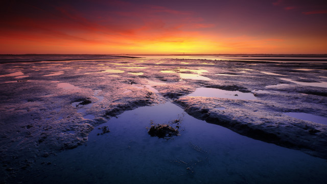 Sunset water ice rocks footprints free wallpaper for desktop - medium preview image