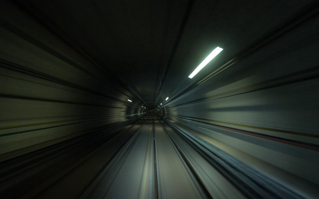 Futuristic train tunnel light person free wallpaper for desktop - medium preview image