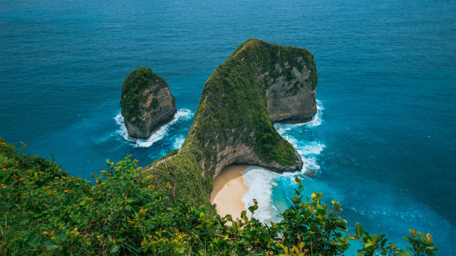 Large rocks green hillside ocean free wallpaper for desktop - medium preview image