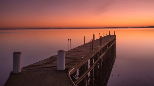 Dock poles lake boats sunset free wallpaper for desktop - medium preview image