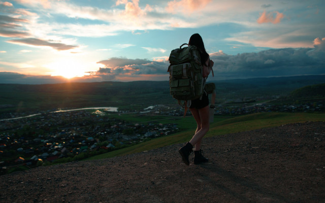 Woman backpack hill sunset town free wallpaper for desktop - medium preview image