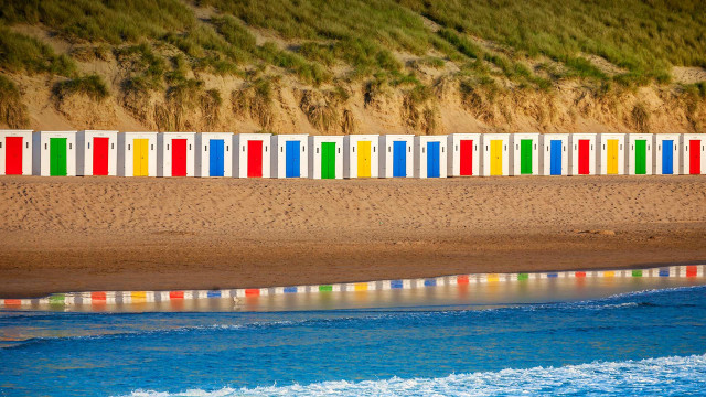 Beach colorful chairs cliff ocean free wallpaper for desktop - medium preview image
