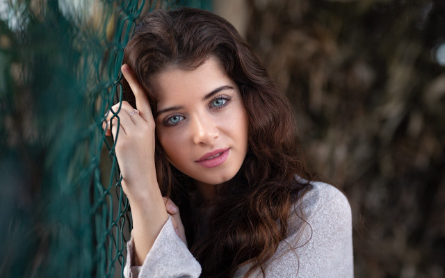 Woman fence serious blueeyes longhair free wallpaper for desktop - medium preview image