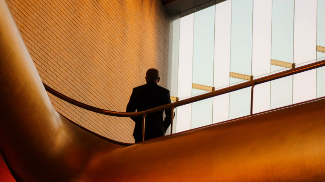 Man in suit staircase building free wallpaper for desktop - medium preview image