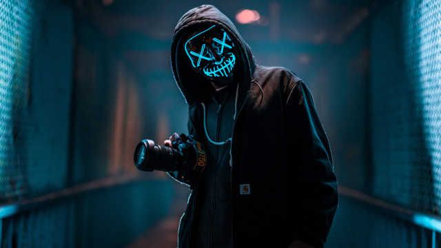 Man hooded jacket camera neon free wallpaper for desktop - medium preview image