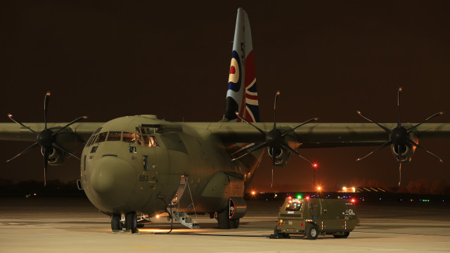 Military plane runway night truck free wallpaper for desktop - medium preview image