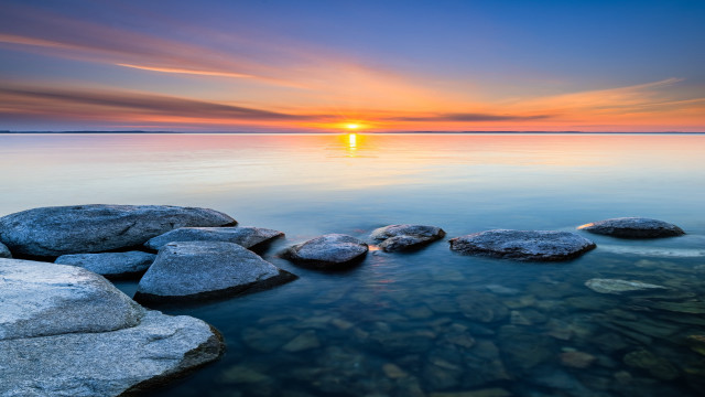 Sunset water rocks beach scene free wallpaper for desktop - medium preview image