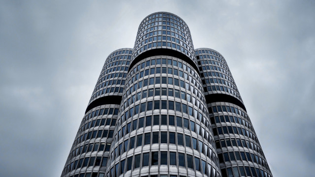 Tall building sky clouds clock free wallpaper for desktop - medium preview image