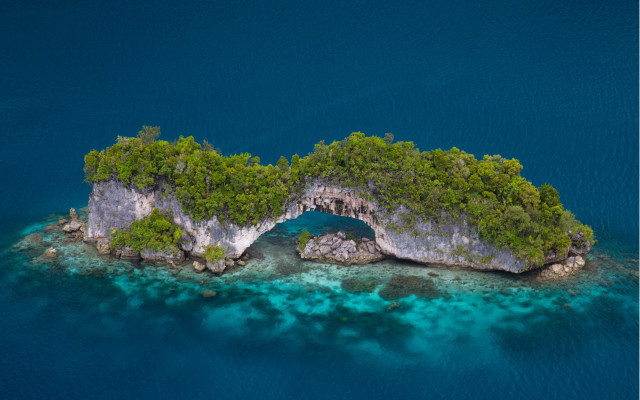 Island cave surrounded by water free wallpaper for desktop - medium preview image