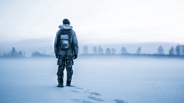 Man snow footprints backpack winter free wallpaper for desktop - medium preview image