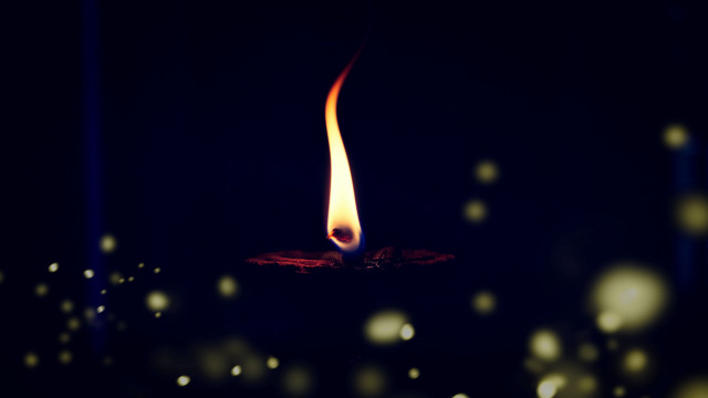 Candle flame dark snow blur free wallpaper for desktop - medium preview image