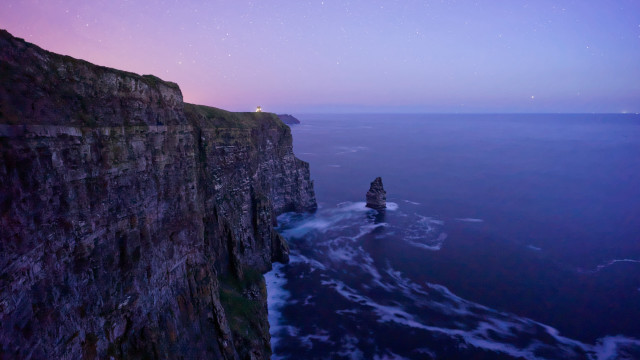 Cliff lighthouse night purple sky free wallpaper for desktop - medium preview image
