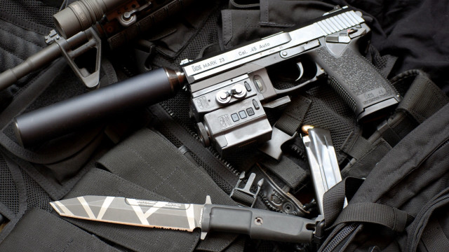 Gun knife backpack city scene free wallpaper for desktop - medium preview image