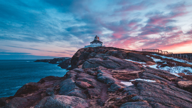 Lighthouse rocky cliff sunset pier free wallpaper for desktop - medium preview image