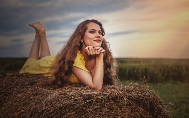 Woman haybale field crossed portrait free wallpaper for desktop - medium preview image