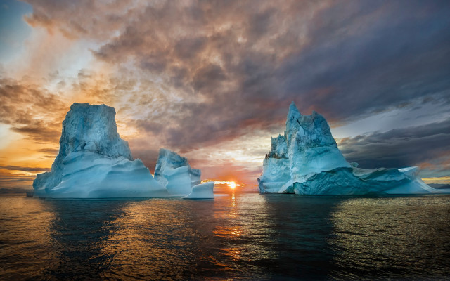 Iceberg sunset ocean clouds mountain free wallpaper for desktop - medium preview image