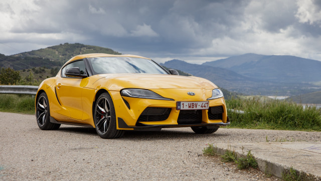 Yellow sports car mountains gravel free wallpaper for desktop - medium preview image