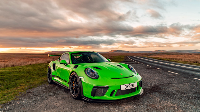Green sports car sunset cloudy free wallpaper for desktop - medium preview image