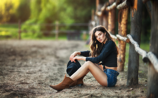 Woman sitting fence cowboyboots blackshirt free wallpaper for desktop - medium preview image