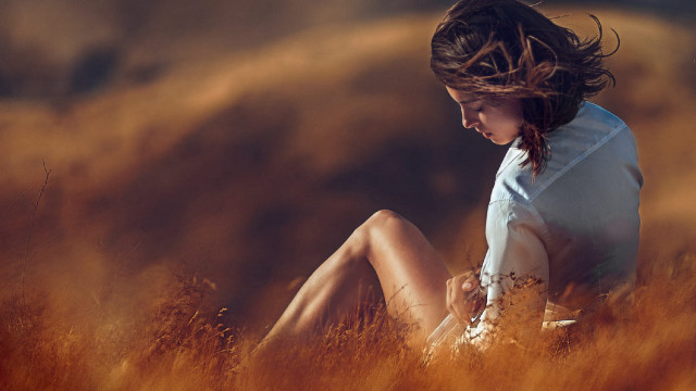 Woman field blowing hair cinematic free wallpaper for desktop - medium preview image