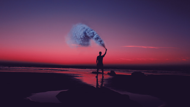 Man beach smoke bomb sunset free wallpaper for desktop - medium preview image