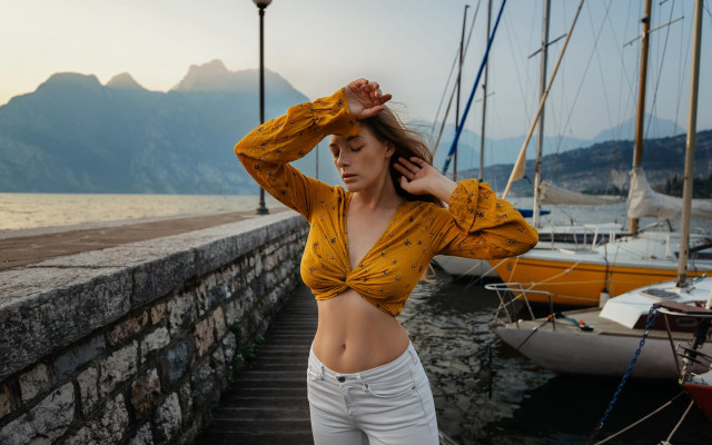 Woman yellow top dock mountains free wallpaper for desktop - medium preview image