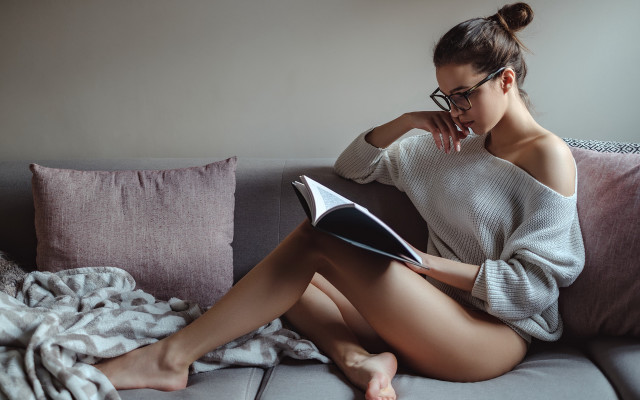 Woman sitting couch reading blanket free wallpaper for desktop - medium preview image