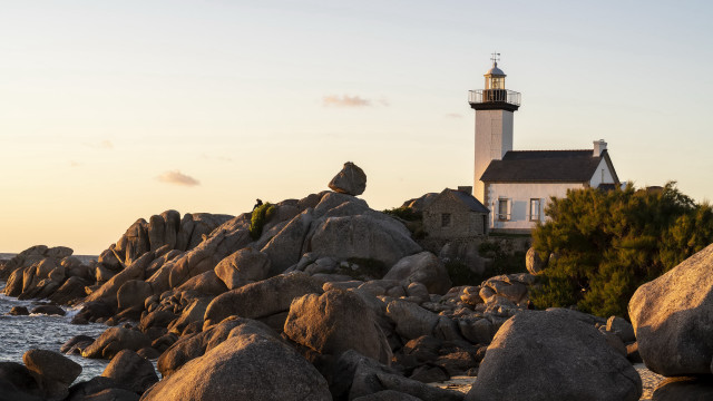 Lighthouse rocky shore dawn mountains free wallpaper for desktop - medium preview image