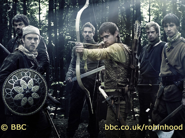 Men holding bows and arrows free wallpaper for desktop - medium preview image